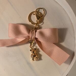 Elegant Pink Bow Keychain with Coach Gold Bear Charm